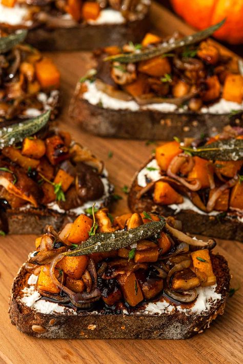 These maple butternut squash crostini include perfectly sautéd mushrooms and shallots, fresh herbs and whipped goat cheese! They also include a divine blackberry balsamic glaze that’s so easy to make and so fun to drizzle! When topped with crispy, salted sage leaves, they make such an enchanting fall appetizer. They’re both sweet and savory, they can be served hot or cold, and they take only about an hour to make! Sautéd Mushrooms, Squash Crostini, Maple Butternut Squash, October Dinner, Halloween Dinner Party Food, Blackberry Balsamic, Fairytale Food, Appetizer Party, Friendsgiving Food