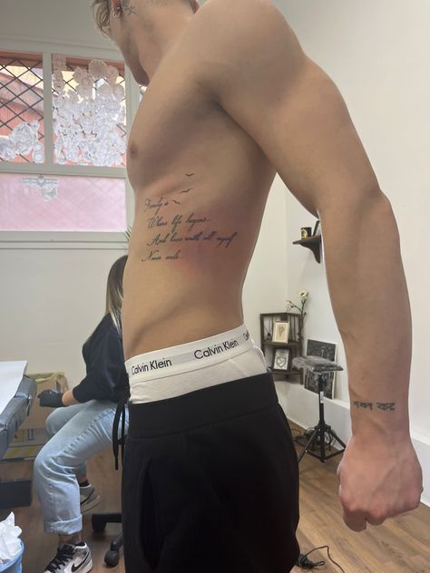 Rib Cage Tattoos For Men Quotes, Rib Writing Tattoo Men, Mens Side Tattoos Ribs, Rib Cage Tattoos For Men, Side Tattoos For Men Ribs, Men’s Rib Tattoo, Men Rib Tattoo, Rib Tattoo Men, Mens Side Tattoos