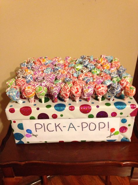 Pick-A-Pop: only a few suckers are marked and will receive a big prize along with keeping the sucker, unmarked pops just keep the pop. Food Ideas For Carnival Party, Fun Prizes For Games, Pick A Pop Game, Sucker Pull Carnival Game, Carnival Game Prizes, Lollipop Carnival Game, Pick A Pop Carnival Game, Sucker Pull Game, Pop Party Theme