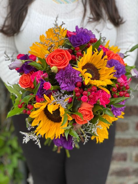 Purple Orange Yellow Wedding Flowers, Red Purple Yellow Bouquet, Plum And Orange Wedding Decorations, Purple Yellow Red Wedding, Red Yellow Purple Flower Arrangements, Sunflower Pink Bouquet, Colorful Prom Bouquet, Purple Arrangements, Iris Wedding Bouquet