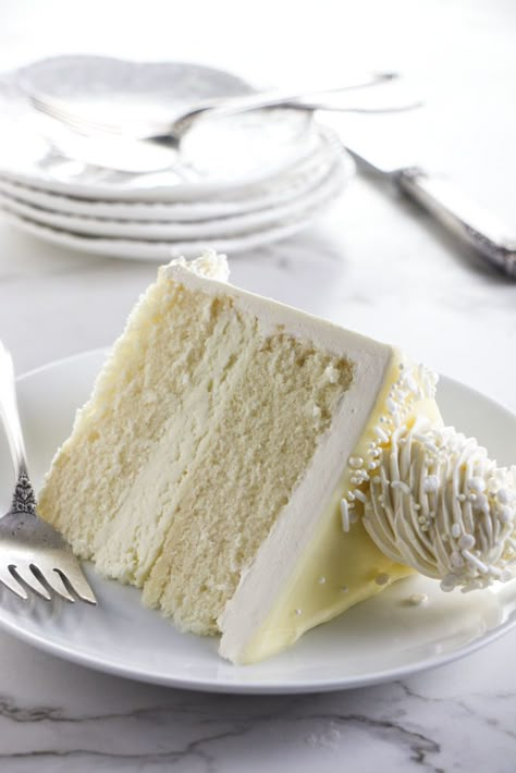 White chocolate cake is elegant, firm and tender, with a fluffy white chocolate mousse filling and a pretty drip ganache design. Lemon Bar Cake, Mousse Cake Filling, White Chocolate Mousse Recipe, White Chocolate Mousse Cake, Lemon Cake Bars, Chocolate Mousse Cake Filling, Amaretto Cake, Raspberry Mousse Cake, Bar Cake