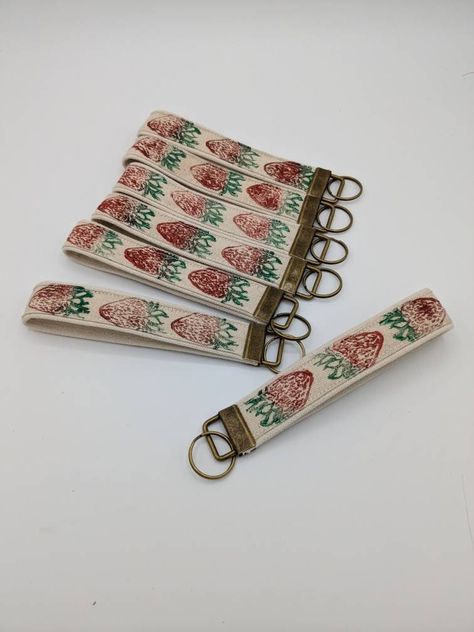 This key fob wristlet is a perfect addition to your keys or zip pouch to hold them around your wrist! I hand carve each of my blocks and print and sew each key fob by hand. Because of the nature of the hand-printed fabric, each print will be unique in color and pattern placement. 🗦Dimensions🗧 The key fob measures 1 inch (2.8 cm) in width, and the fabric of the key fob measures 5.25 inches (14 cm) in length. The medium pouch measures 8 in. by 5.5 in. and includes a divider inside the pouch.  🗦Shipment & Delivery🗧 --Once your item is made and shipped, you will receive a shipping notification via email through Etsy with estimated delivery dates. 🗦Contact me with questions!🗧message me on Etsy or email rachel@queridadesigns.com 🗦Check out the rest of my shop!🗧www.queridadesigns.etsy.com Key Fob Wristlet, Cool Car Accessories, Key Fobs Wristlet, Hand Printed Fabric, Key Lanyard, Be Unique, Cute Cars, Key Fobs, Zip Pouch