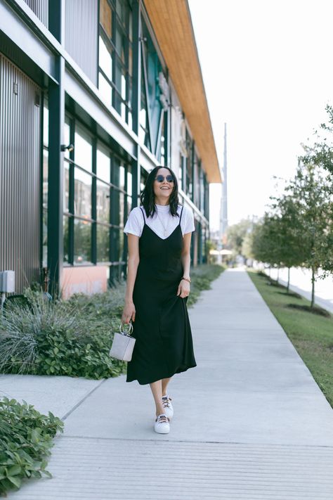 White T Shirt Under Dress Outfit, Dress With A Tshirt Outfit, Black Dress Over Shirt, White Top Under Dress, Tank Top Dress With Shirt Under, T Shirt Under Slip Dress, Slip Dress With Shirt Under, Satin Dress With Shirt Under, White Tshirt Layered Outfit