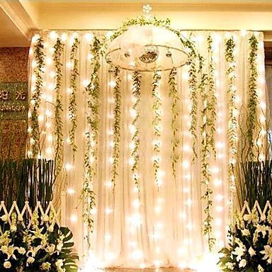 Create your own magical woodsy lamp backdrop with strings of lights mixed with garlands of greenery. Enchanted Forest Prom, Enchanted Forest Decorations, Enchanted Forest Theme, Prom Themes, Rustic Wedding Decorations, Enchanted Forest Wedding, Christmas Light Ornament, Prom Decor, Prom Theme