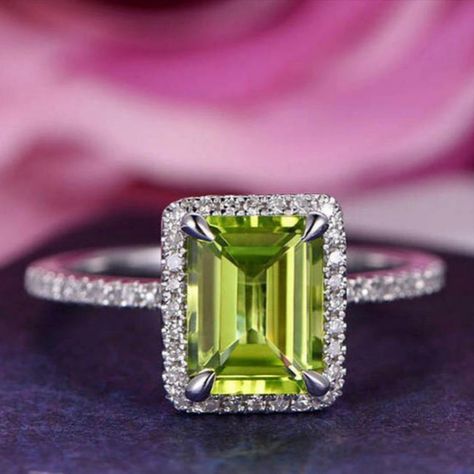 *Item Description

*Item :- Ring

*Gemstone :- Peridot

*Color :- Green

*Weight :- 1.6 Ct (Approx.)

*Size :- 6 X 8 MM

*Shape :- Rectangle

*Secondary Stone :-

*Gemstone :- Cubic Zircon

*Color :- White

*Weight :- 0.23 Ct (Approx.)

*Shape :- Round

*Style :- Minimalist

*Finishing :- Super Fine

*Ring Size :- US 4 to US 13 Peridot Engagement Ring, Silver Halo Ring, Peridot Engagement Rings, Sapphire Wedding Band, Gold Diamond Band, Peridot Jewelry, White Gold Wedding Rings, Sterling Silver Engagement Rings, Peridot Ring