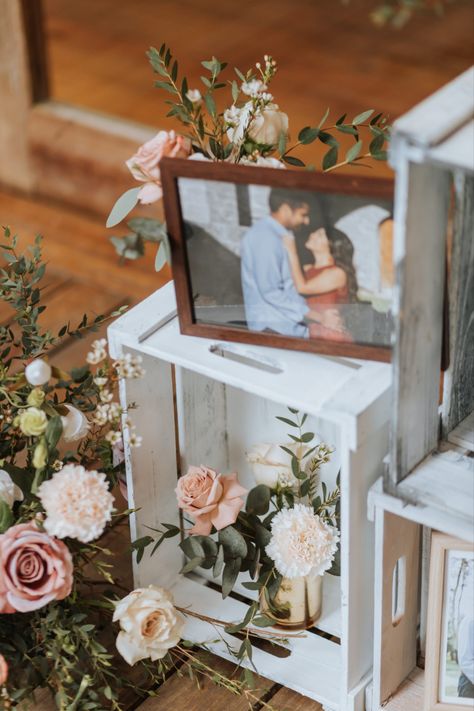 Simple and cute pre-wedding photo display arrangement in wooden elevations decorated with floral arrangements, to have at your wedding for guests to see. Wedding Photo Display, Bar Mitzva, Country Theme Wedding, Country Theme, Wedding 2025, 2024 Wedding, Peach Wedding, Photo Display, Pre Wedding Photos