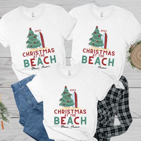 If you're spending Christmas on the beach this year, these Christmas At The Beach shirts are perfect! These ultra soft tropical Christmas shirts makes perfect for Christmas vacation shirts for the whole crew and can be personalized with the year/location for an extra touch! These family Christmas group shirts are perfect matching tees for the whole family! --- Christmas At The Beach Shirt, Tropical Christmas Shirt, Christmas On The Beach, Christmas Vacation Shirts, Family Christmas Group Shirts Christmas On The Beach, Vacation Shirts Family, Christmas At The Beach, Christmas Vacation Shirts, Tropical Christmas, Beach Christmas, Group Shirts, Matching Tees, Hawaii Beaches