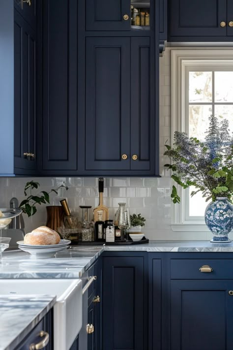 Explore 50+ modern farmhouse kitchen ideas incorporating navy blue cabinets and inviting islands, perfect for family meals and entertaining. Navy Lower Cabinets, Blue Kitchen With Gold Hardware, Blue Classic Kitchen, Blue Kitchen With Granite Countertops, Blue Themed Kitchen Ideas, Indigo Cabinets, Blue Paint Kitchen Cabinets, Navy Blue Kitchen Islands, Navy Bar Cabinets