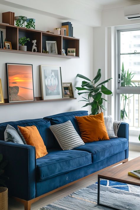 Living Room Decor Ideas Blue Couch, 70s Living Room Blue Couch, Cute And Cozy Living Room Ideas, Blue Sofa Eclectic Living Room, Blue Sofa Apartment Living Room, Blue Sofa Sitting Room Ideas, Blue Sofa Mid Century Living Room, Blue Living Room Accessories, Two Color Sofa