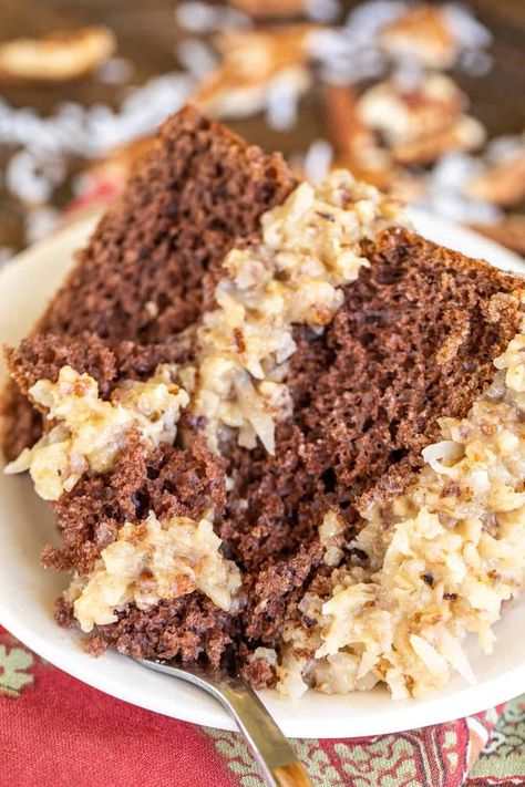 Easy German Chocolate Cake - if you like chocolate cake, coconut, and pecans, you are going to LOVE this dessert. This is a semi-homemade cake, meaning that I doctored up a box of cake mix and made the frosting from scratch. The frosting is to-die-for! Evaporated milk, sugar, egg yolks, butter, vanilla, coconut, and pecans. Can make in advance and refrigerate until ready to serve the cake. Great for dinner parties, birthdays, and potlucks. German Chocolate Cake From Scratch, Easy German Chocolate Cake, Homemade Chocolate Buttercream Frosting, Homemade German Chocolate Cake, Chocolate Cake Mix Recipes, German Chocolate Cake Recipe, Chocolate Cake From Scratch, Homemade Chocolate Frosting, German Chocolate Cake Mix