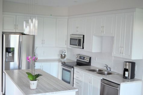 White cabinets with granite