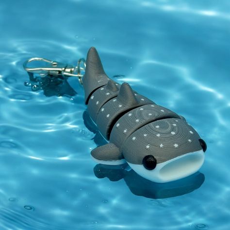 Add a splash of charm to your bag with this 3d printed whale shark bag charm! Stand out in a sea of ordinary accessories and let the quirky design make a statement. Perfect for the ocean lover in all of us. (Warning: may attract real whale sharks (!) - use with caution). Length - 3 1/2" Shark Lover Gifts, Whale Shark Decor, Whale Shark Bag, Shark Merch, Whale Shark Plush, Shark Things, Shark Keychain, Shark Accessories, Shark Stuff