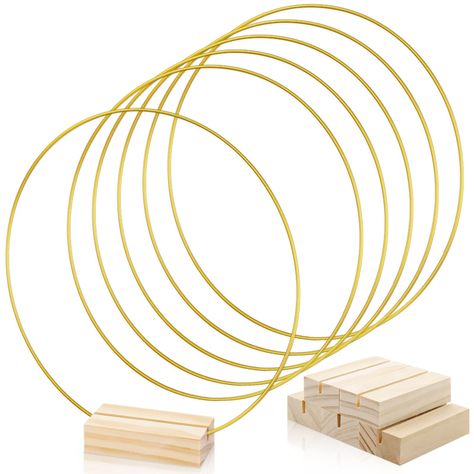 PRICES MAY VARY. Package Includes: You will receive 5 pieces of golden metal rings with 5 pieces wood place card holder in the package, enough for you to decorate your wedding, engagement, party. Size: The gold round metal hoops is about 10 inches in diameter and the wood place card holders is 2.75 x 1.38 x 0.7 inch / 7 x 3.5 x 1.8 cm. High Quanlity: The metal hoop is made of sturdy metal, each thickness is 3mm. They do not deform or break easily. This wooden stand is made from natural wood, and Table Decorations For Wedding, Metal Wreath Ring, Hoop Centerpiece, Wood Place Card Holders, Centerpiece For Table, Floral Hoop Wreath, Hanging Crafts, Diy Wedding Decor, Wreath Ring