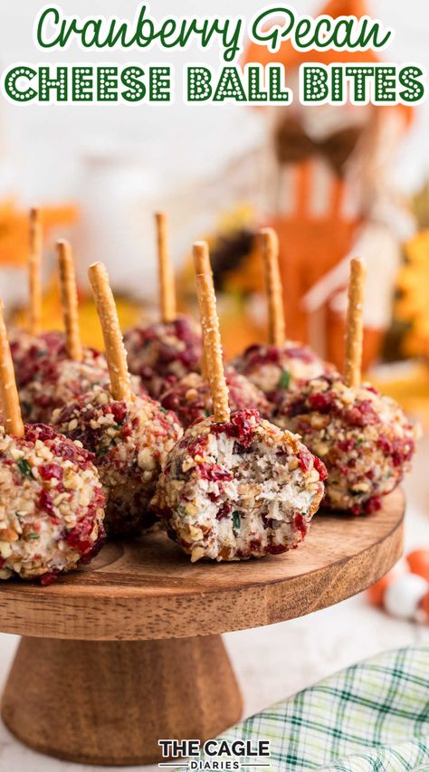 Cheese Ball Pretzel Stick, Cranberry Pecan Cheese Ball Bites, Cheese Balls On Pretzel Sticks, Pretzel Stick Cheese Balls, Cranberry Cheese Bites, Mini Cheese Ball Bites Pretzel Sticks, Cranberry Nut Cream Cheese Balls, Finger Foods On A Stick, Christmas Mini Cheese Balls