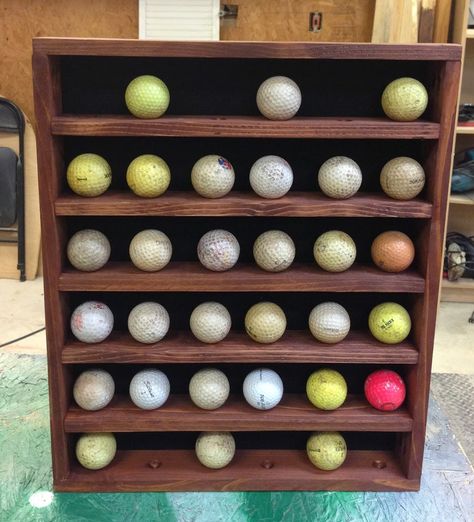 I have been busy making Christmas presents and I wanted to share what I made for my Dad. It didn’t come out as perfect as I was hoping, but I think he will still like it. Excuse the dirty golf balls, they were the only ones I could round up on short notice. As you can see … Golf Ball Display, Golf Ball Display Case, Diy Golf, Golf Ball Holder, Golf Ball Displays, Golf Birthday Gifts, Golf Ball Gift, Ball Display, Golf Ball Crafts