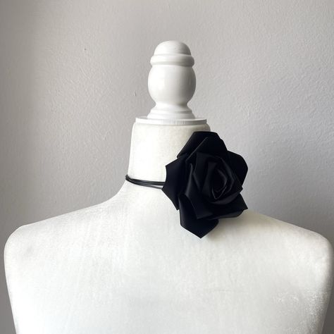 This black satin flower choker is made with high quality satin for a sophisticated  and elegant touch. Wether you are looking for yourself or for a gift, this choker necklace is sure to please. The choker can be adjusted to fit any neck size as you see in the pictures.  Select your products carefully as no returns or exchanges are accepted. This piece is in perfect condition as you see on the picture. Once chosen and approved by the customer before shipment, the order is completed. All sales are final. Contact seller should you have any questions or doubts. Seller is not responsible for lost or stolen packages.   ----------------------------------------------------------------------------------------------------------------------------------------------- Esta gargantilla de flores de satén Black Flower Choker, Girls Choker, Flower Choker Necklace, Flower Choker, Womens Chokers, Necklace Flower, Neck Choker, Satin Flowers, Black Choker