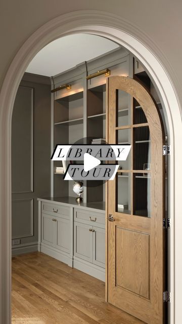 Melissa Manzardo Hryszko on Instagram: "Walk through the custom-arched white oak French doors into the cozy and inviting library. With applied wall moulding, exquisite millwork, and charming accent lights, this is a space our clients can cozy up in with a great book.  And did you notice the plugs and switches? We lucked out and sourced a colour from @lutronbydesign that matched the wall colour almost perfectly.   #library #homelibrary #homeoffice #arch #housegoals #dreamhome #instahome #briarhillcustom" Library French Doors, Arched Office Doors, Arched Double Doors Interior, White Oak French Doors, Office French Doors Study, Arched Built Ins Living Room, Arched French Doors Interior, Arched Entryway, Office French Doors