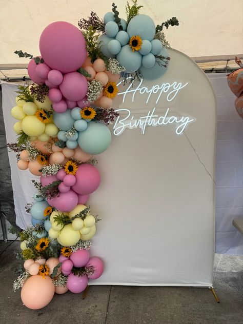 Soring and floral balloon garland Balloon Flower Garland, Fairy Theme Balloon Garland, Wild Flower Balloon Garland, Floral Backdrop With Balloons, Ballon And Flower Arch Diy, Balloon Garland Flowers, Wildflower Balloon Backdrop, Love In Bloom Balloon Arch, Wild Flower Balloon Arch