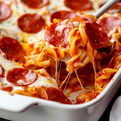 This pepperoni pizza casserole has everything you love about pizza in a one-pan dish! In less than an hour, you'll have a fabulous meal everyone will devour. Pepperoni Pizza Casserole Recipe, Easy Pepperoni Pizza, Pepperoni Pizza Casserole, Pizza Casserole Recipe, Pizza Sauce Homemade, Pizza Casserole, Cauliflower Pizza, Homemade Marinara, Pasta Dinner Recipes