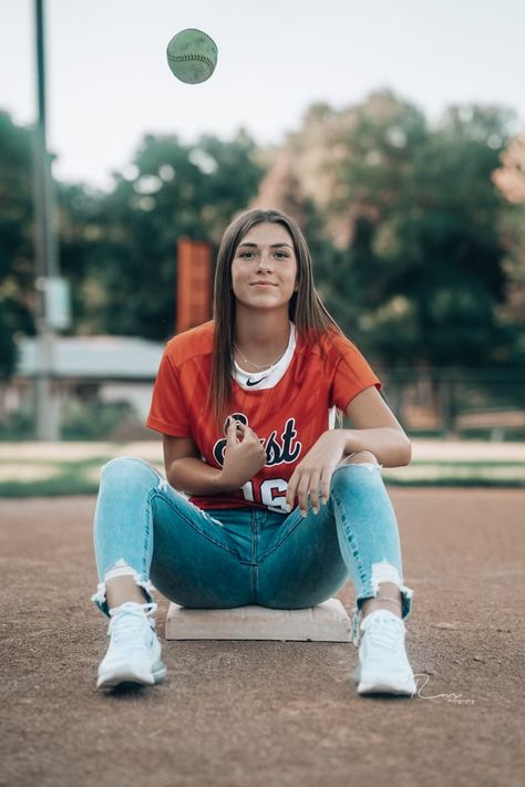 Senior Softball Pictures With Cap And Gown, Softball Pictures Senior, Senior Picture Ideas Multiple Sports, Softball Poses For Pictures Photo Ideas, Outdoor Sports Senior Pictures, Softball Field Senior Pictures, Senior Picture Ideas Jersey, Senior Picture Ideas Softball Pitcher, Senior Pics With Jerseys