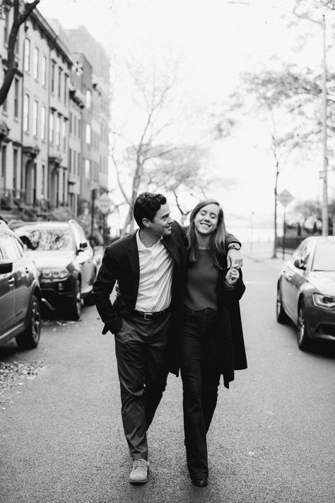 Black and white portrait of couple walking down street Couple Walking Pose Reference, Couple Walking Reference, Two People Walking Together, Couple Walking Photography, Couple Walking Together Aesthetic, Walking Down Street Aesthetic, Couples Walking Together, Street Photography Couple, Couple Pose Black And White