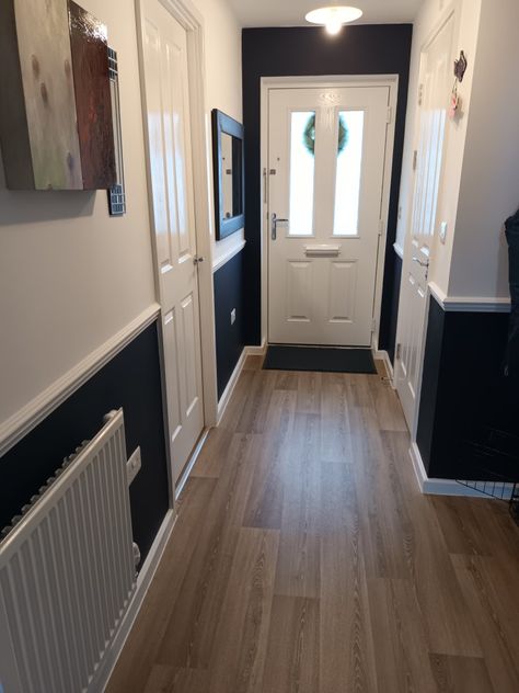 Hall in dark navy and white. Loving the result. Hall With Dado Rail, Hall Dado Rail Hallways, Painted Dado Rail Hallway, Hallway Panelling Black, Hallway Ideas With Dado Rail, Hallway Dark Floor, Dado Rail Decorating Ideas, Navy Blue Hallway Ideas, Blue Panelling Hallway