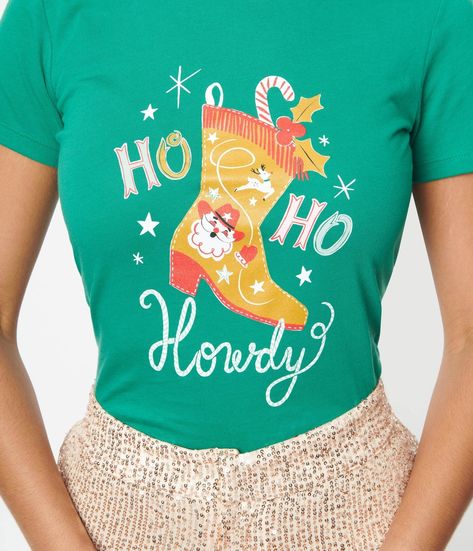 This adorable holiday fitted graphic tee from Unique Vintage is crafted in green cotton, and features a graphic print of a cowboy boot stocking and the font ‘ Ho Ho Howdy’. Available in sizes S-2X while supplies last. Uv Clothing, The Font, Cowboy Boot, Ho Ho Ho, Vintage Branding, Tee Outfit, Retro Tshirt, Vintage Store, Model Pictures