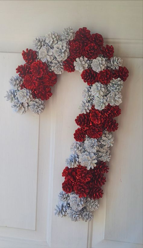 Pinecones Crafts, Candy Cane Christmas Decor, Crochet Candy Cane, Candy Cane Wreath Diy, Winter Displays, Pinecone Wreaths, Pine Cone Flower Wreath, Pine Cone Christmas Decorations, Christmas Candy Cane Decorations