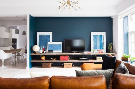 tips on incorporating TVs seamlessly into a space from studio McGee Therapy Photo, Blue Feature Wall, Soho Apartment, Loft Style Apartments, Tricorn Black, Loft Style Apartment, Feature Wall Living Room, Blue Accent Walls, Charcoal Blue