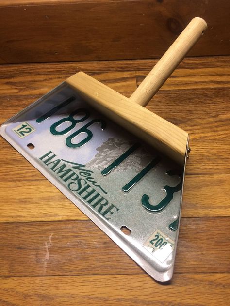 "License plate dust pan, What could be cooler!  You can hang this dust pan up on display or use it to clean up.  Shown is a New Hampshire license plate, this plate is mounted using screws to a cedar wood backing and a 1\" dia.  pine wood handle which is drilled for a string to be looped thru.  The wood is raw unfinished.   You can start by choosing a wood and finish variation below.   If you don't have a plate of your own, I can use one that I have in stock or locate something specific for you.  (Additional cost for locating a specific plate).  Or you can send me a plate that has special meaning to you and I can make it into a dust pan.  There are many different wood and finish options to choose from.  Some wood and finish options will help to enhance the look of your special plate.  You c Wood Projects That Sell, Wood Shop Projects, Scrap Wood Projects, Dust Pan, Homemade Tools, Wooden Projects, Wood Creations, Small Wood Projects, Cedar Wood