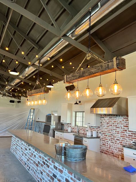 60" barn beam with five glass globes . Light fixture was stained using Minwax Honey stain color. Customer may choose their own stain color. The fixture includes an authentic antique barn pulley. GLASS GLOBE SHOWN IN PICTURE IS NOT AVAILABLE AT THIS TIME  Choice of three styles of glass globes as pictured individually above. Barn Ceiling Ideas, Minwax Honey Stain, Barn Renovation Ideas, Warehouse Home Converted, Winery Interior Design, Party Barn Interior, Barndominium Layout, Ranch Retreat, Barn Beam Lighting