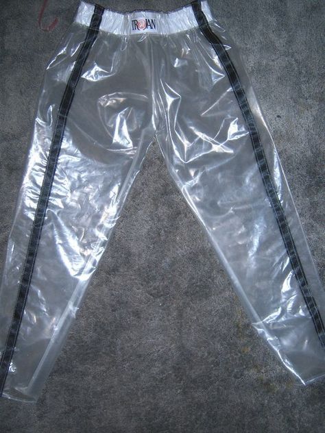 Clear vinyl athletic-style pans with black vertical stripes.. DIY the look yourself: http://mjtrends.com/pins.php?name=clear-vinyl-for-pants #RaincoatsForWomenBlue Clear Pants, Pvc Trousers, Plastic Outfit, Mannequin Legs, Plastic Fashion, Peter Jensen, Material Ideas, Waterproof Jacket Women, Plastic Fantastic