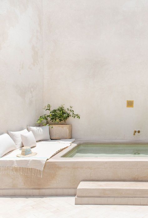 The defining picture of Riad Vivre is that of a majestic waterfall gracefully pouring into the courtyard’s alluring plunge pool through shimmering cascades amid the fragrant whispers of bougainvillea and jasmine. #marrakechluxuryriad #marrakechbestriads #bestriadsinmarrakech #bestriadsmarrakech #marrakechriad #mostbeautifulriadsmarrakech #riadsmarrakechinspiration #besthotelsmarrakech #wheretostayinmarrakechhotels #riadmarrakechboutiquehotels Riad Pool, Modern Mediterranean Backyard, Courtyard With Pool, Mediterranean Backyard, Majestic Waterfall, Outdoor Jacuzzi, Courtyard Pool, Plunge Pools, Small Patio Garden