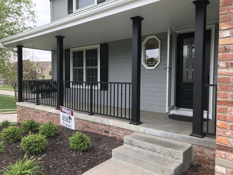 Black Porch Columns Brick House, Black Front Porch Railing Ideas, Black Posts On Front Porch, Front Porch Deck Ideas Mobile Homes, Black Pillars On Front Porch, Black Front Porch Ideas, Black Front Porch Railing, Black Railing Front Porch, Black Porch Columns