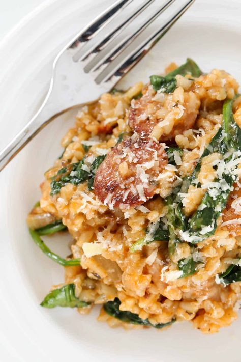 This oven-baked chicken and chorizo risotto with spinach and sun dried tomato pesto is a rich, creamy and comforting meal. Made with a handful of basic ingredients, chicken chorizo risotto is a delicious weeknight dinner that the whole family will love! Just 20 minutes prep time and ready to eat in under 50 minutes. #chicken #chorizo #risotto #italian #dinner Chicken And Chorizo Risotto, Chorizo Risotto, Sun Dried Tomato Pesto, Chicken And Chorizo, Chicken Risotto, Chicken Chorizo, Easy Chicken And Rice, Chicken Breast Fillet, Chorizo Sausage