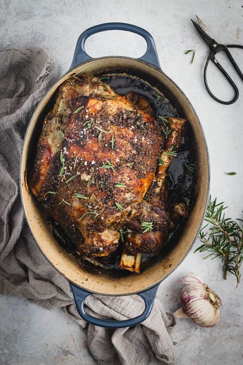 This super easy and delicious Dutch oven leg of lamb recipe is full of fresh garlic and rosemary. A roast night classic dinner! Leg Of Lamb Roast Boneless Dutch Oven, Dutch Oven Leg Of Lamb, Boneless Leg Of Lamb Recipes Dutch Oven, Irish Lamb Recipes, Dutch Oven Lamb Roast, Roasted Lamb Leg Boneless, Boneless Butterflied Leg Of Lamb Recipes, Braised Leg Of Lamb Recipes, Lamp Leg Recipe