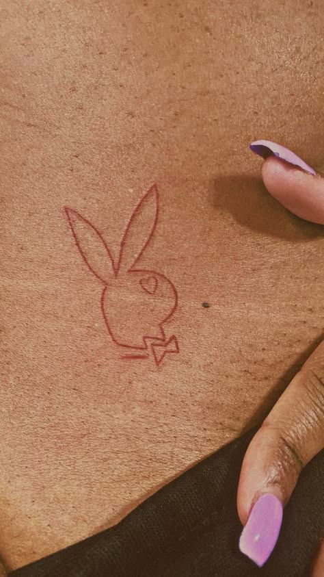 Playboy Bunny Tattoo Hip, Playboy Tattoo Design, Cherry Tattoo On Bum For Women, Tiny Hip Tattoos For Women, Play Boy Tattoo, Playboy Drawing, Peekaboo Tattoo, Playboy Bunny Tattoo Design, Tattoos For Baddies