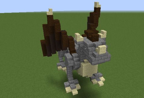 Dragon Statue - GrabCraft - Your number one source for MineCraft buildings, blueprints, tips, ideas, floorplans! Minecraft Viking Statue, Minecraft Dragon Statue, Minecraft Pretty, Medieval Statue, Minecraft Mountain Castle, Statue Minecraft, Mountain Castle, Minecraft Mountain, Vikings Statue