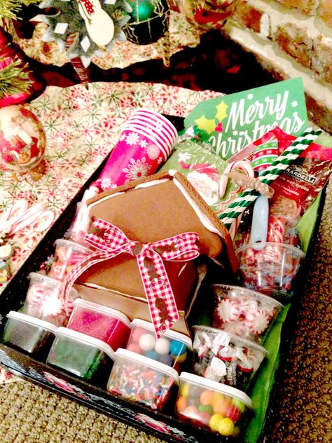 Easy #DIY Gingerbread-Decorating Gift Box #Holidays via @justmeasuringup  http://www.justmeasuringup.com/blog/easy-diy-gingerbread-decorating-gift-basket Christmas Gift Baskets For Kids, Gift Baskets For Kids, Diy Gingerbread House, Homemade Gingerbread House, Baskets For Kids, Gingerbread House Decorating, Ginger Bread House Diy, Diy Gingerbread, Gingerbread House Parties