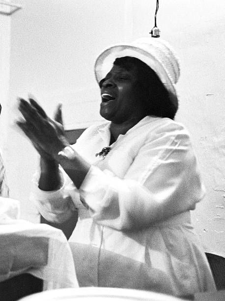 A female pastor leads her flock during a religious service, possibly at the Christ Temple Apostolic Church, a storefront church in Chicago, IL, 1967. (Photo by Robert Abbott Sengstacke/Getty Images) Black Church Aesthetic, Female Pastor, Black Moodboard, Christian Head Covering, Music Corner, Church Aesthetic, Women Church, Black Church, Church Hat