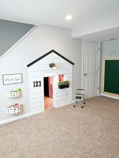 this basement, understairs playhouse was one of my favorite house updates this year. Check out this blog post to see the full update on our house and the tour of this fun house! https://www.arinsolangeathome.com #playhouse #diy Under Stairs Playhouse, تحت الدرج, Bilik Idaman, Basement Playroom, Toddler Playroom, Playroom Design, غرفة ملابس, Basement Renovations, Toy Rooms