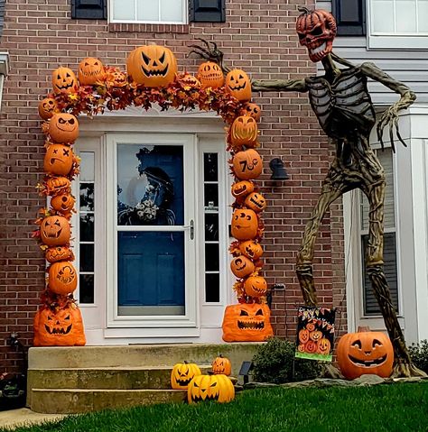 My 2021 pumpkin arch with my 12 ft Inferno Pumpkin Skeleton Pumpkin Arch Front Porch, 12 Ft Skeleton Ideas Halloween, Pumpkin Archway Diy, 12 Ft Skeleton Ideas, 12 Ft Skeleton, 12ft Skeleton, Halloween Doorway, Pumpkin Arch, Skeleton Ideas