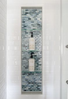 Niche In Shower Wall Tile, Marble Shower With Blue Accent Tile, Blue Glass Bathroom Tile, Shower Niche With Glass Shelf, Blue Accent Tile Bathroom, Vertical Shower Niche With Shelves, White Shower With Niche, White And Blue Shower Tile Ideas, Shower Niche Tile Ideas Accent Wall