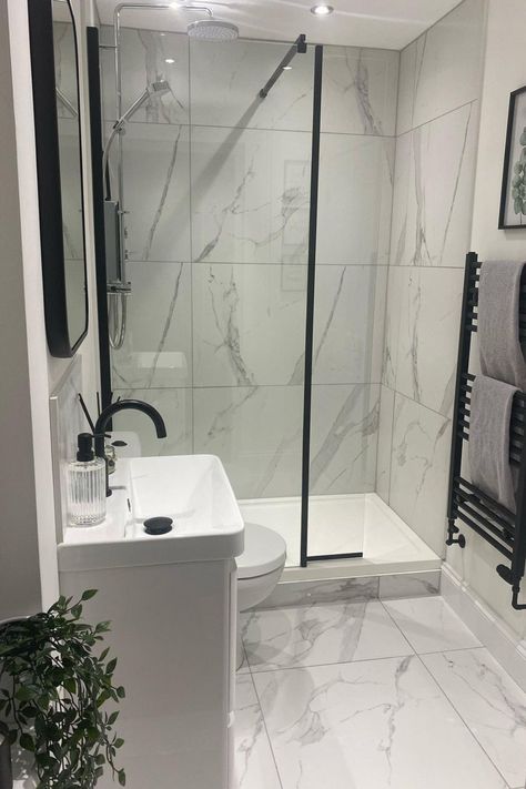 White Bathroom Black Accessories, Grey And White Bathroom With Black Fixtures, Grey Bathroom Black Accessories, White Marble Bathroom Accessories, Small Monochrome Bathroom, Bathroom Inspiration Black And White, Black And White Shower Room Ideas, White Marble Bathroom With Black Accents, Black And White Ensuite Bathroom