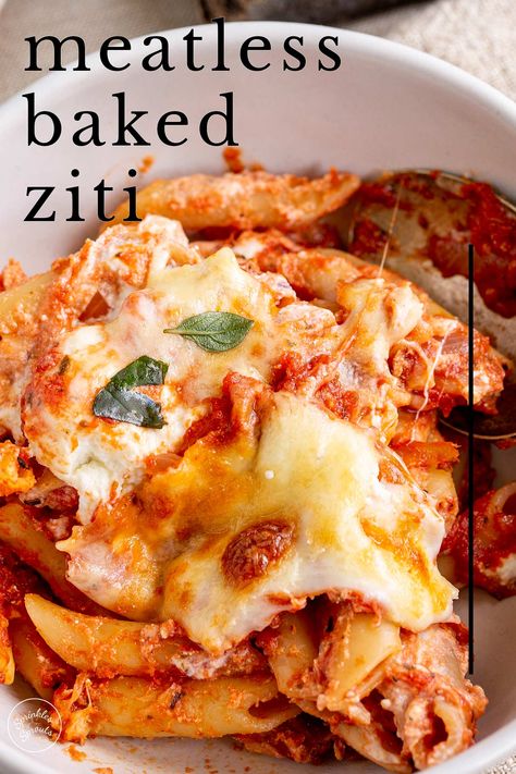 This Meatless Baked Ziti is a delicious warming dish perfect for a comforting dinner to share with loved ones. This fantastic pasta bake is the vegetarian version of a classic baked ziti. It is easy to make and is loaded with flavor, thanks to an easy-to-make rich tomato sauce and three kinds of cheese - ricotta for creaminess, mozzarella for those all-important string cheese pulls, and parmesan for some sharp, salty cheese flavor. Baked Mostaccioli Recipe Easy, Baked Ziti Vegetarian, Meatless Baked Ziti, Baked Mostaccioli Recipe, Classic Baked Ziti, Baked Mostaccioli, Baked Ziti With Ricotta, Pasta Casseroles, Baked Rigatoni