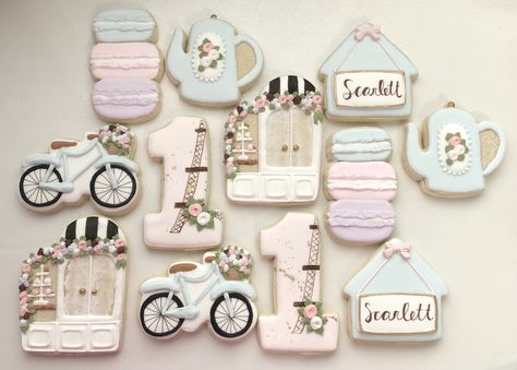 "Paris themed sugar cookies offer a variety of designs, sizes, and colors that can be further customized. Please let me know if you want a different design, color scheme, or just want to add more of a certain design etc...I'm here to make your order special.  This order is for 12 sugar cookies. Once an order is received and payment is confirmed your cookies will be baked and hand-decorated prior to your event date. No two cookies are exactly alike. Photos are representative of cookies that will Eiffel Tower Cookies Decorated, Paris Themed Cookies, Paris Cookies Decorated, Fashion Cookies Decorated, Paris First Birthday Party, Paris Cookies, Parisian Birthday Party, Paris Themed Cakes, French Themed Wedding