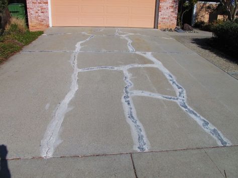 This cracked concrete driveway can be made to look like new with not too much effort. Photo Credit: Julie C., San Jose, CA Concrete Patio Resurfacing, Fix Cracked Concrete, Repair Concrete Driveway, Concrete Driveway Resurfacing, Driveway Paint, Concrete Refinishing, Cement Driveway, Repair Cracked Concrete, Patio Repair