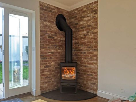 Gas Stove Fireplace Brick, Wood Burner In Corner Of Room, Brick Slip Fireplace Ideas, Brick Around Wood Stove, Brick Fireplace Wood Stove, Corner Wood Burner Fireplace Ideas, Tiles Behind Stove Wood Burning, Wood Stove Slate Surround, Wood Burning Stove Corner Ideas