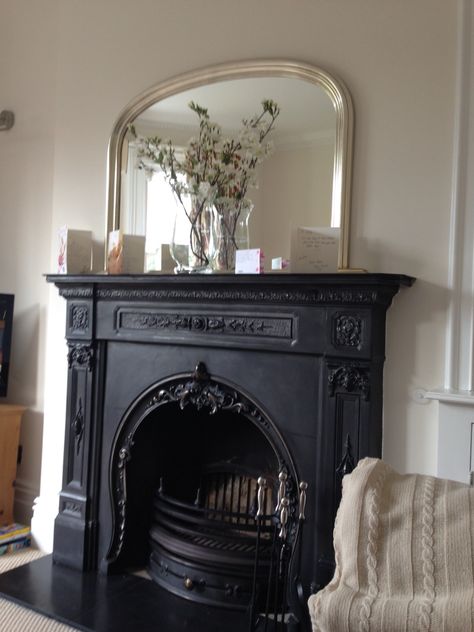 Beautiful iron fireplace with over mantle mirror above Mirror Over Fireplace, Mirror Above Fireplace, Edwardian Fireplace, Over Mantle, Mantle Mirror, Vintage Fireplace, Black Fireplace, Victorian Fireplace, Fireplace Garden