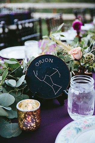 Celestial Retro Ranch Wedding | Nearly Newlywed Blog Wedding Blog Astronomy Table Decor, Cosmos Wedding Theme, Celestial Event Decor, Wedding Celestial Theme, Celestial Table Numbers, Celestial Wedding Groom, Celestial Table Decor, Celestial Centerpiece Wedding, Celestial Wedding Theme Color Schemes